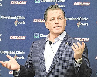 Cleveland Cavaliers owner Dan Gilbert answers questions during a news conference Wednesday at the team’s training facility, in Independence. Gilbert expressed support for his management and coaching staff, optimism
for the future —thanks in part to the development of rookie Kyrie Irving — and a belief the Cavaliers could be
back in the playoffs as soon as next season.