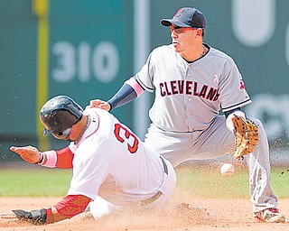 Boston Red Sox’s Mike Aviles, left, steals second base as Cleveland Indians shortstop Asdrubal Cabrera is unable to get his glove on the ball in the sixth inning of a baseball game at Fenway Park in Boston on Sunday.