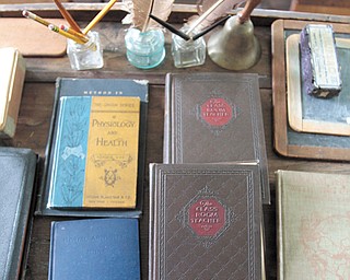 Quills, inkwells and even teacher ledgers still occupy the teacher’s desk in the Caldwell One Room School Museum.