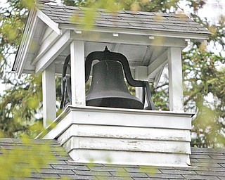 The original school bell still works and sits atop the brick building.