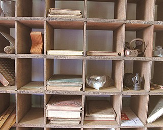 Wooden boxes still hold books and items collected from one-room schoolhouses throughout Mercer County.