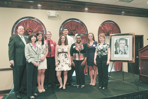 John York and Denise DeBartolo York, left, presented scholarships to eight Mahoning Valley high-school students, Jessica Fox of Mineral Ridge High School, Brian Boccieri Jr., of Girard High School, Sara Lopez of Salem High School, Aaron Page of West Branch High School, Nilyshia Johnson of Chaney High School, Dana Nocera of John F. Kennedy High School and Diane Moody of Lakeview High School, during a Monday luncheon at the Holiday Inn in Boardman. The eighth recipient, Carmen Moradian of Boardman High School, did not attend.