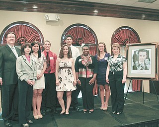 John York and Denise DeBartolo York, left, presented scholarships to eight Mahoning Valley high-school students, Jessica Fox of Mineral Ridge High School, Brian Boccieri Jr., of Girard High School, Sara Lopez of Salem High School, Aaron Page of West Branch High School, Nilyshia Johnson of Chaney High School, Dana Nocera of John F. Kennedy High School and Diane Moody of Lakeview High School, during a Monday luncheon at the Holiday Inn in Boardman. The eighth recipient, Carmen Moradian of Boardman High School, did not attend.