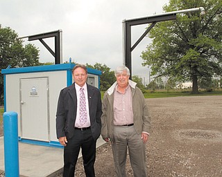 Struthers Mayor Terry Stocker, left, and Al Sauline, area manager for Aqua Ohio, show off Aqua Ohio’s new pump station that will serve trucks getting water for delivery to hydraulic-fracturing sites in Ohio.