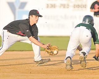 Girard shortstop Nick Cavalier attempts to pick off Ursuline’s Joel Hake. Hake was out on the play, but the Irish beat the Indians in the Division III district final, 3-2, in extra innings.