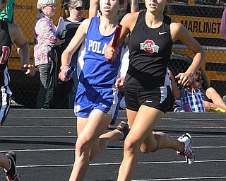 (816) of Poland and (104) of Salem are stride for stride during the 4 x 400 meter relay Thursday afternoon in Salem. - Nick Mays l The Vindicator