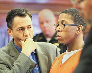 Randal Brown, right, faces sentencing with his attorney, Ronald Yarwood, in the courtroom of Judge R. Scott Krichbaum of Mahoning County Common Pleas Court. The judge sentenced Brown to three years in prison Thursday for having unprotected sex with a woman while knowing he was HIV-positive.