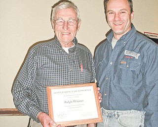 Ralph Witmer, left, of Columbiana, was recently presented with a certificate of recognition by Steve Knizat, vice president of the Columbiana County Fairboard. Every year, individuals from across the state are recognized for their outstanding support of local fairs during ceremonies at the Ohio Fairs convention in Columbus. Witmer represented the Columbiana Fair with this honor and was thanked by the board for his continued devotion and support of the fair through the years.
