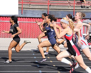 Junior Aminah Wesley of Warren G. Harding leads the pack during the half way mark of the 100 meter dash during Fridays Division one district championship track meet at Austintown Fitch High School.  Dustin Livesay  |  The Vindicator
