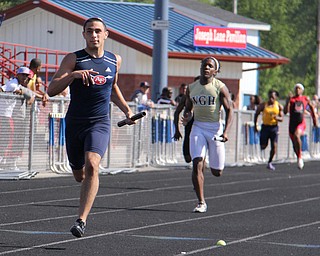 Nathan Bowlen of Fitch leads his 4x200 meter relay team to first place during Fridays Division one district championship track meet at Austintown Fitch High School. Dustin Livesay  |  The Vindicator