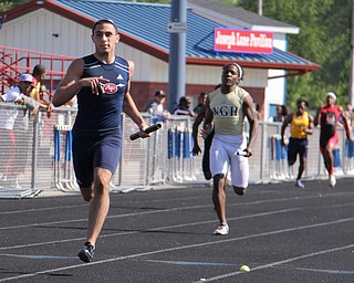 Nathan Bowlen of Fitch leads his 4x200 meter relay team to first place during Fridays Division one district championship track meet at Austintown Fitch High School. Dustin Livesay | The Vindicator