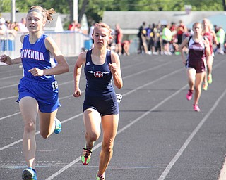 Olivia Chinn (left) of Ravenna runs neck and neck with Carissa Jenkins (right) of Austintown Fitch to the finish line of the 1600 meter run during Fridays Division one district championship track meet at Austintown Fitch High School.  Dustin Livesay  |  The Vindicator