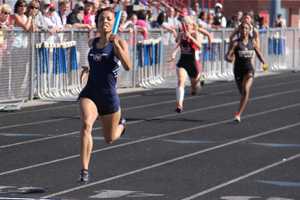 Theresa Scott of Fitch runs far out front of the pack helping her 4x100 meter relay team of Jenna Yacovone, Ebony Davis, and Amber Brown win the race and set a new district record during Fridays Division one district championship track meet at Austintown Fitch High School.  Dustin Livesay  |  The Vindicator