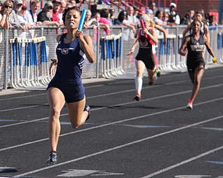 Theresa Scott of Fitch runs far out front of the pack helping her 4x100 meter relay team of Jenna Yacovone, Ebony Davis, and Amber Brown win the race and set a new district record during Fridays Division one district championship track meet at Austintown Fitch High School. Dustin Livesay | The Vindicator