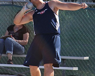Billy Price of Austintown Fitch comes around his final spin and prepares to release the shot put during Fridays Division one district championship track meet at Austintown Fitch High School.  Dustin Livesay  |  The Vindicator