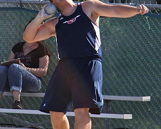 Billy Price of Austintown Fitch comes around his final spin and prepares to release the shot put during Fridays Division one district championship track meet at Austintown Fitch High School. Dustin Livesay | The Vindicator