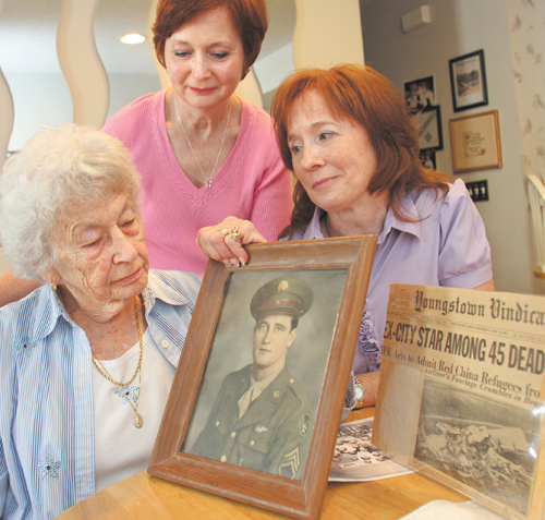 Rosemary McIntire, left, recalls memories of her first husband, Maurice Hamilton, who was killed in a plane bombing. Two of her daughters, Roseann Cencia, center, and Teresa Kondis, right, discuss their father and how their lives changed after his death. Hamilton and 44 others were killed May 22, 1962, when a bomb placed in the plane’s bathroom brought the aircraft down over the Iowa/Missouri line.