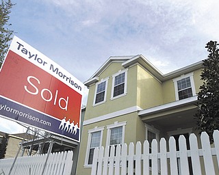 A “sold” sign stands outside a home in Riverview, Fla. Americans bought more previously owned homes in
April, a hopeful sign that the weak housing market gradually is improving. Home sales in Ohio increased
11.3 percent in the first four months of 2012 compared with 2011.