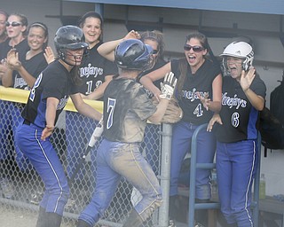 JESSICA M. KANALAS | THE VINDICATOR..Jackson Milton's #7 Shannon Ricketson slides safely into home during the bottom of the third inning against Mathews for the Division 3 Regional Semifinal game at Kent State University.