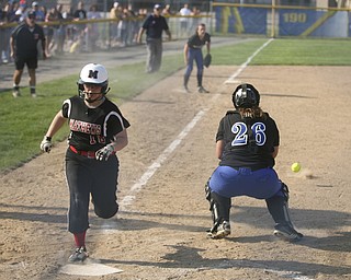 JESSICA M. KANALAS  | THE VINDICATOR..Due to an error on a pick-off attempt at third base, Mathews #16 Hollie Shreves safely steals home during the top of the fourth inning against Jackson Milton for the Division 3 Regional Semifinal game at Kent State University.