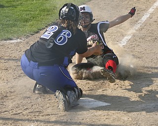 JESSICA M. KANALAS  | THE VINDICATOR..Mathews #15 Tabby Granelly is tagged out at home plate during the top of the fourth inning against Jackson Milton for the Division 3 Regional Semifinal game at Kent State University.