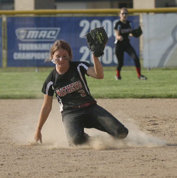 JESSICA M. KANALAS  | THE VINDICATOR..Mathews #3 slides on her knees as she makes an catch during the bottom of the fourth inning against Jackson Milton for the Division 3 Regional Semifinal game at Kent State University.
