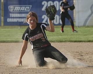 JESSICA M. KANALAS | THE VINDICATOR..Mathews #3 slides on her knees as she makes an catch during the bottom of the fourth inning against Jackson Milton for the Division 3 Regional Semifinal game at Kent State University.