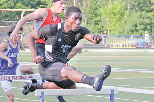 East’s Valentino Sewell clears the first hurdle during the boys 300-meter event at Wednesday’s Division I regional track meet at Austintown Fitch High School. Sewell advances to Saturday’s finals in the 300 and 110 hurdle events.