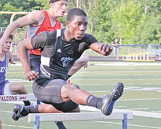 East’s Valentino Sewell clears the first hurdle during the boys 300-meter event at Wednesday’s Division I regional track meet at Austintown Fitch High School. Sewell advances to Saturday’s finals in the 300 and 110 hurdle events.