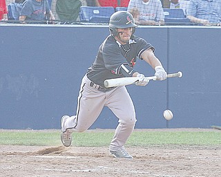 Canfield’s Ben Angelo lays down a bunt during a Division II regional semifinal baseball game against Canton South on Thursday at The Ballpark at Hudson High School. The Cardinals dominated the Wildcats, 14-1, to advance to the regional final today against Mentor Lake Catholic.