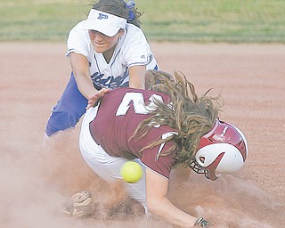Kalie Benson (21) of Poland and Samantha Schneider (2) collide at second base during the sixth inning of their
Division II regional semifinal softball game Thursday at Firestone Stadium in Akron. Poland held on to defeat
Woodridge, 3-2, and advance to the final Saturday against Akron Hoban.