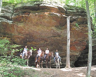 Dominic and Lisa Pannunzio and their children, Andrea and Anthony, go horseback riding in Hocking Hills State Park in southern Ohio.