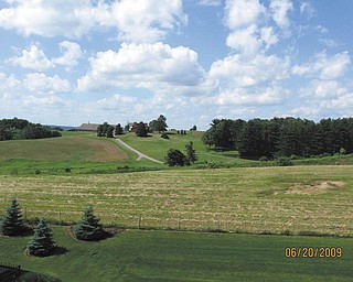 Here's a country scene in Holmes County, Ohio, sent in by J.E. Ferrett of Hubbard.