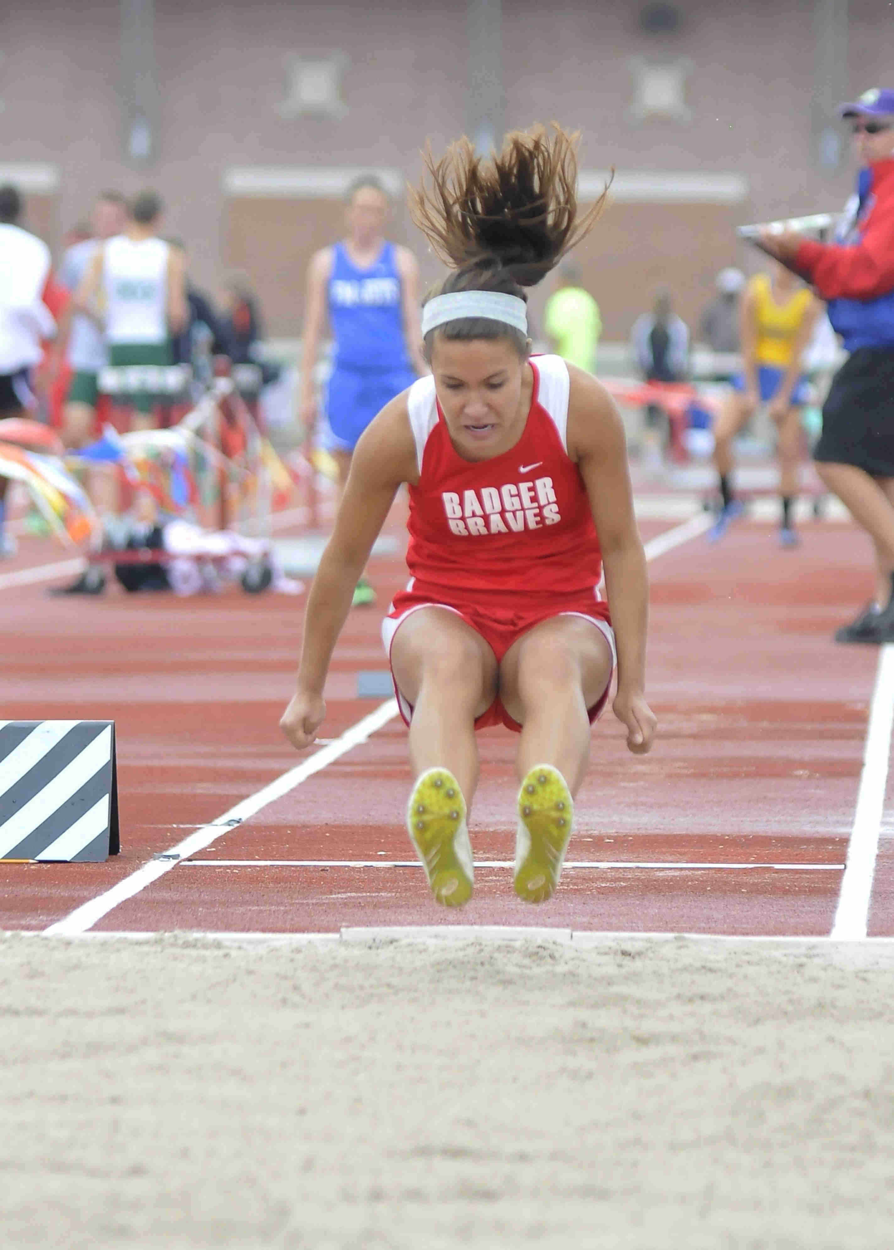 Jennilyn Krumpe of Badger makes a jump during the girls long jump Friday afternoon at the State Track Meet in Columbus. She would finish eleventh in divison three.