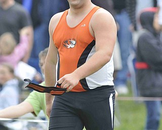 Stephen Lyons of Springfield smiles after hearing the cheers from his friends and family after throwing the shot put Friday afternoon at the State Track Meet in Columbus.