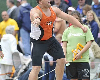 Stephen Lyons screams after throwing the shot put Friday afternoon at the State Track Meet in Columbus.
