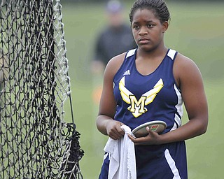Jai'Lyn Mosley of McDonald stands becide the discus cage before her final throw Friday afternoon at the State Track Meet in Columbus. She would finish second in divison three.
