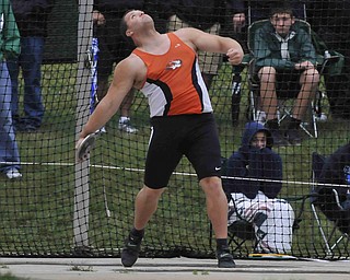 Springfield's Stephen Lyons throws the discus during the boys discus Friday afternoon in Columbus.