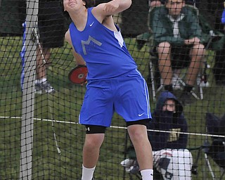 Maplewood's Stephen Pop throws the discus during the boys discus Friday afternoon in Columbus.