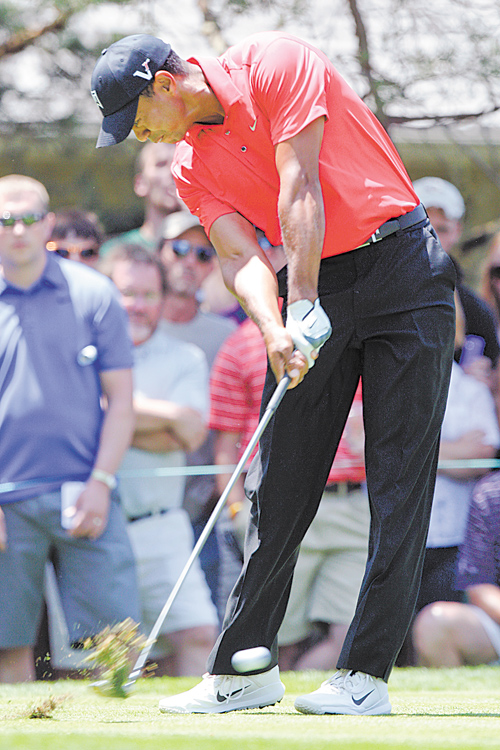 Tiger Woods tees off on the second hole during the final round of the Memorial golf tournament Sunday in
Dublin, Ohio. Woods birdied the hole.
