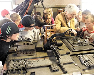 Students from Canfield’s Hilltop Elementary School tour the Mahoning Dispatch print shop as part of their look at historic Canfield landmarks. Eileen Merz from the Canfield Historical Society showed the youngsters how type was set to produce the now-defunct city newspaper during the Tuesday tour.