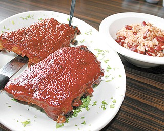 Baby Back Ribs with a side of Rice from the Phoenix Fire Grill and Bar.