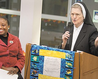 Sister Jerome Corcoran addresses an audience at Millcreek Children’s Center in Youngstown to welcome Michele D. Grant as the center’s new executive director. Grant resigned as director a month later. Sister Jerome, 96, continued as director, but she was notified in late May that she was no longer head of the school she founded.