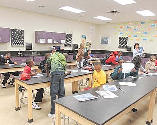 Chaney students in the Science, Technology, Engineering and Mathematics program participate in a summer-enrichment program at the school. In an exercise Wednesday, students looked for shapes in photographs of clouds.