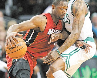 The Miami Heat’s Dwyane Wade drives against the Boston Celtics Marquis Daniels during Game 6 of the NBA Eastern Conference finals Thursday In Boston. The Heat defeated the Celtics, 98-79, to tie the series 3-3 and force Game 7.