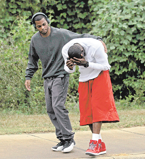 Investigators were searching Sunday for a gunman who killed three people — including two former Auburn University football players — and wounded three others at a pool party near campus after several men got in a fight over a woman, authorities and witnesses said.