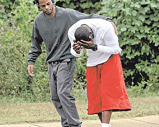 Investigators were searching Sunday for a gunman who killed three people — including two former Auburn University football players — and wounded three others at a pool party near campus after several men got in a fight over a woman, authorities and witnesses said.