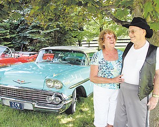 Fred and Rosemary Ross stand next to their 1958 Chevy Impala. The Hubbard couple drove a similar ’58 Impala for their honeymoon and plan to drive this one to celebrate their 50th wedding anniversary in August.