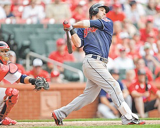 St. Louis Cardinals catcher Yadier Molina watches as the Cleveland Indians’ Jason Kipnis connects for a three-run homer in the ninth inning of Sunday’s baseball game in St. Louis. The Indians beat the Cardinals 4-1.