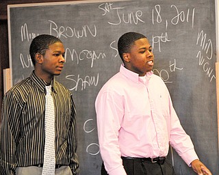 Deandre McCreary, 16, left, and Rayshawn Royal, 17, enter the courtroom of Judge Maureen A. Sweeney of Mahoning County Common Pleas Court on Monday for the afternoon session of their trial on aggravated murder and aggravated robbery charges in the June 18, 2011, fatal shooting of 16-year-old Brandon Adkins on Youngstown’s South Side. McCreary and Royal were bound over from juvenile court for trial as adults.
